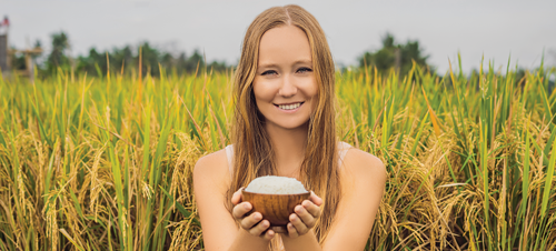 Happy woman with rice
