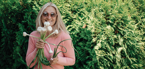 Woman with garlic bulbs